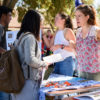 Grayson Melby, left, Recruitment and Outreach Officer, and Lisa Manzanete,right, Events and Programming Officer, from the Fascinate organization recruit at the 2017 Student Activities Fair