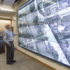 David Rumsey examines a historical map of Paris in the David Rumsey Map Center in Green Library.