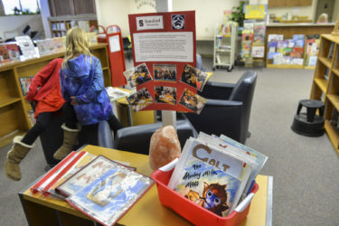 Books produced in previous versions of PWR2EE, on display in the Nixon library.