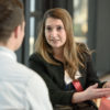 Erika Topete meets with a prospective graduate student at a recent event on financial literacy..