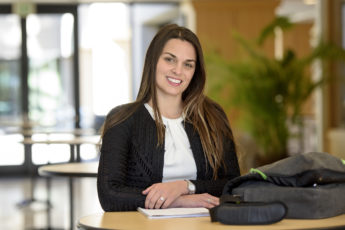 Danielle Maddix standing by a table