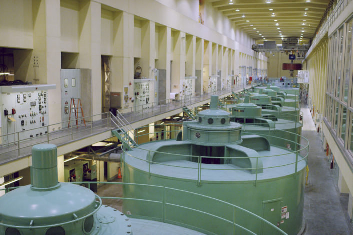 A series of large generators inside a dam)