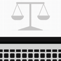 The scales of justice on a laptop screen.