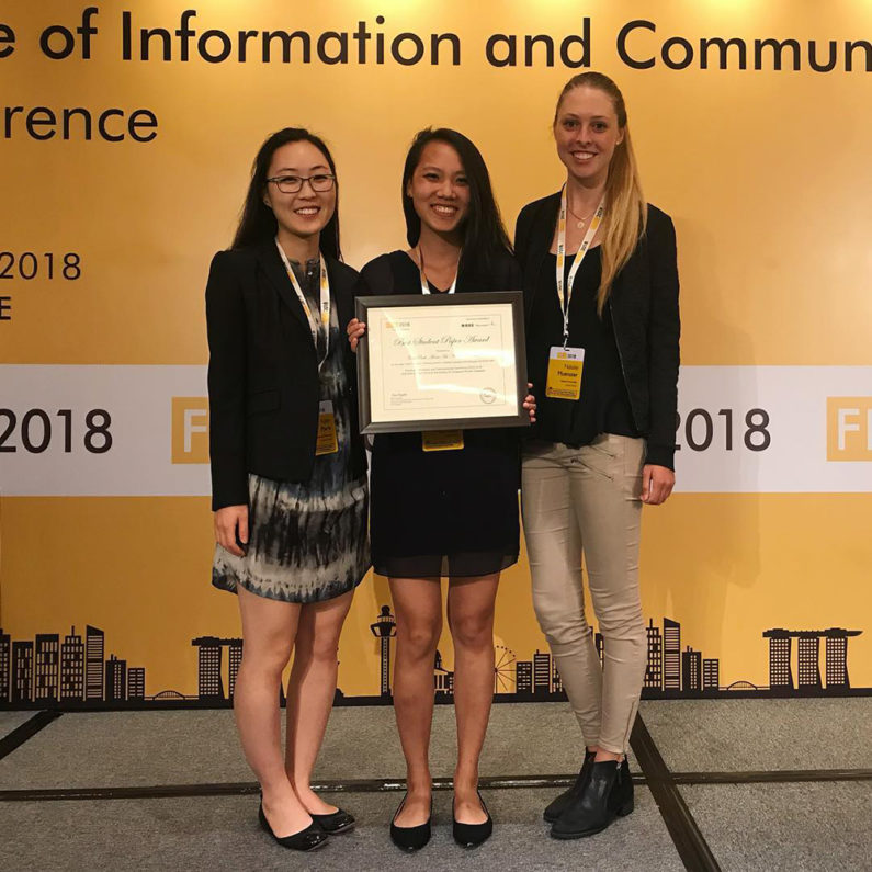 Students Park, Hu and Muenster posing with their award for Best Student Paper