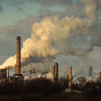 smoke coming from an oil refinery in the U.S.