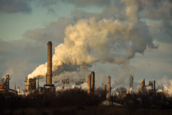 smoke coming from an oil refinery in the U.S.