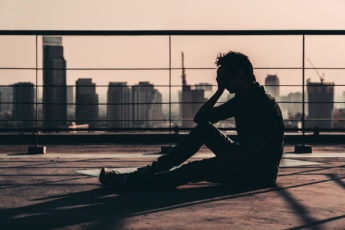 Silhouette of depressed man