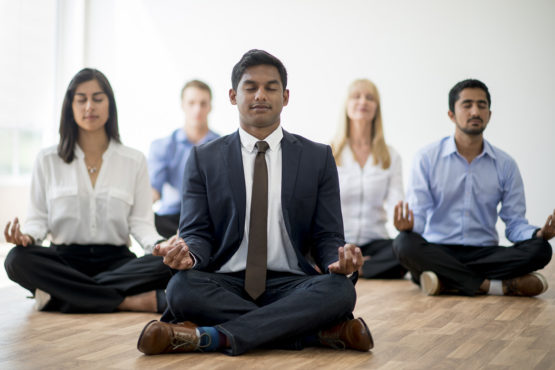 Business people meditating.