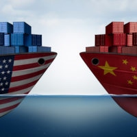 China United States trade and American tariffs as two opposing cargo ships as an economic taxation dispute over import and exports concept as a 3D illustration.