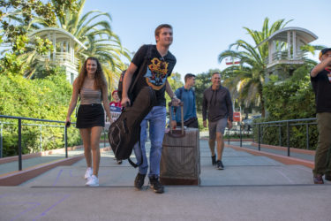 Guitar in hand, Tristan Rice of Constantia, New York, smiles as he pulls up to his dorm.