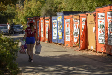 Students retrieve their belongings from shipping containers delivered near their dorms.