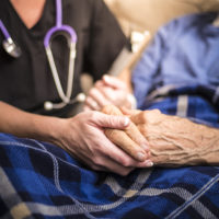 Nurse and man in hospice care