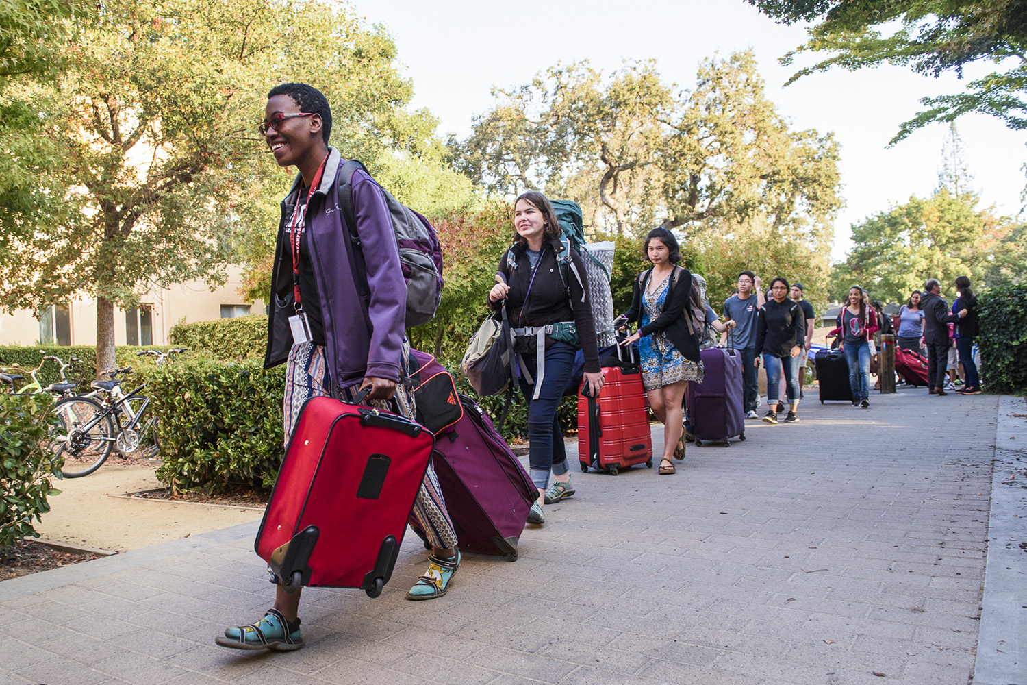 Some of the first students in line at FroSoCo make their way to the welcome table with their luggage in tow. Move-In Day. NSO 2016