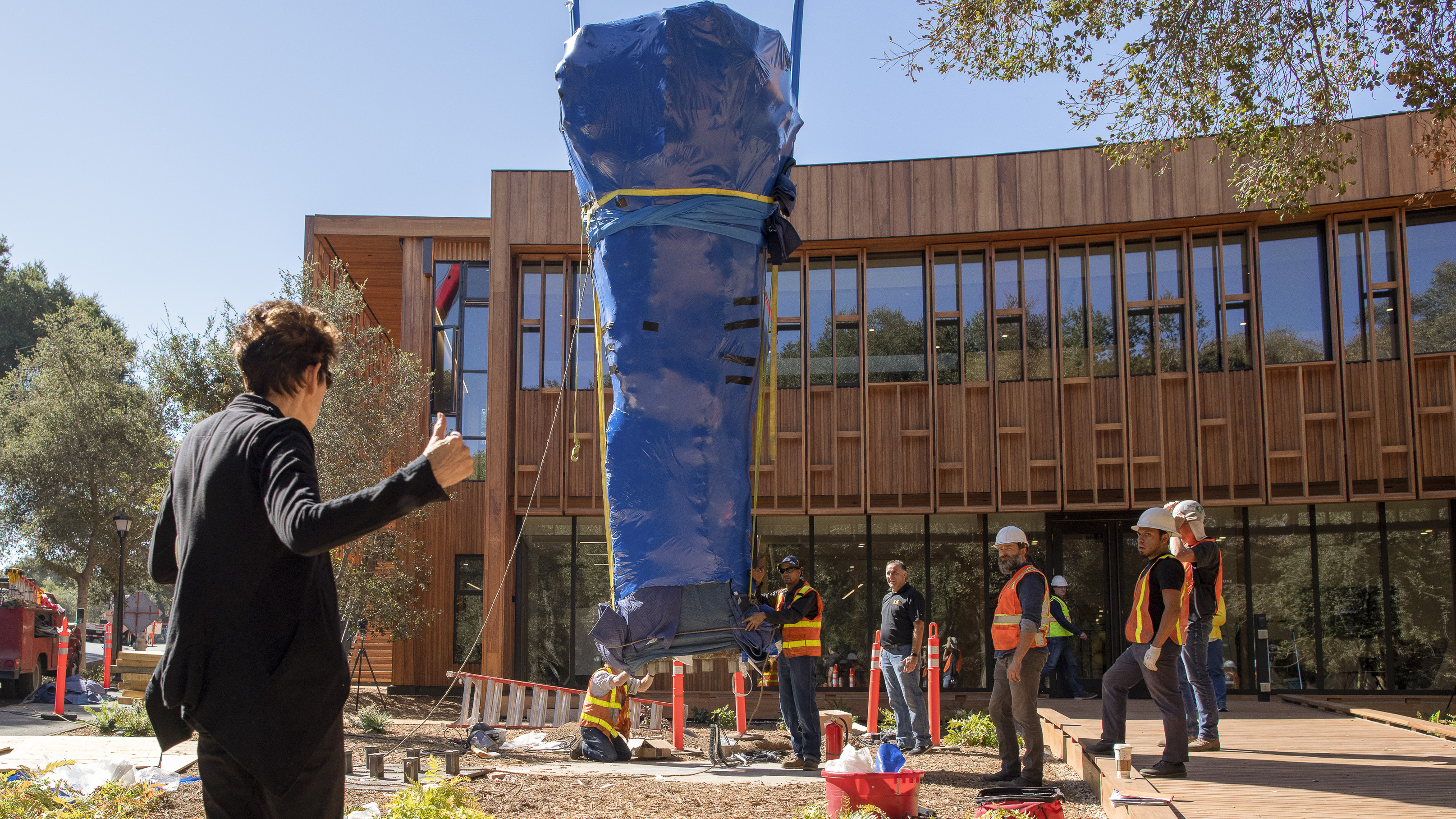 The installation of the bronze sculpture at Denning House