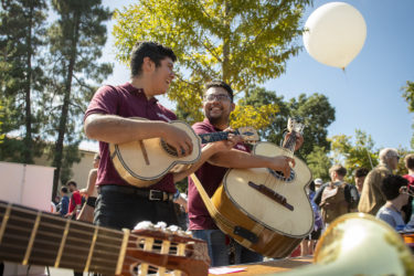 Eric Sosa-Lesso plays the vihuela and Joel Ramirez plays the guitarron