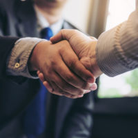 Two people shaking hands