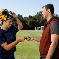 Concussion researcher and football player