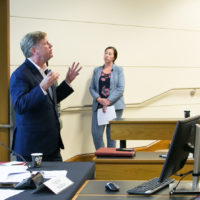 Michael McFaul standing before the auditorium