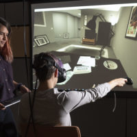 Fernanda Herrera, left, watches as fellow student Hannah Mieczkowski