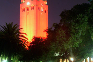 Hoover Tower bathed in cardinal red.