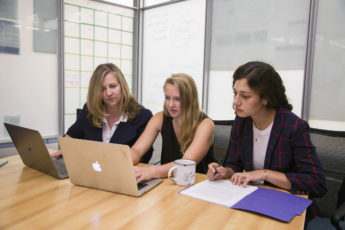 English lecturer Alice Staveley, left, meets with Stanford junior Emily Elott and second-year English doctoral candidate Anna Mukamal