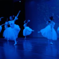 Dancers in white dresses performing the Nutcracker