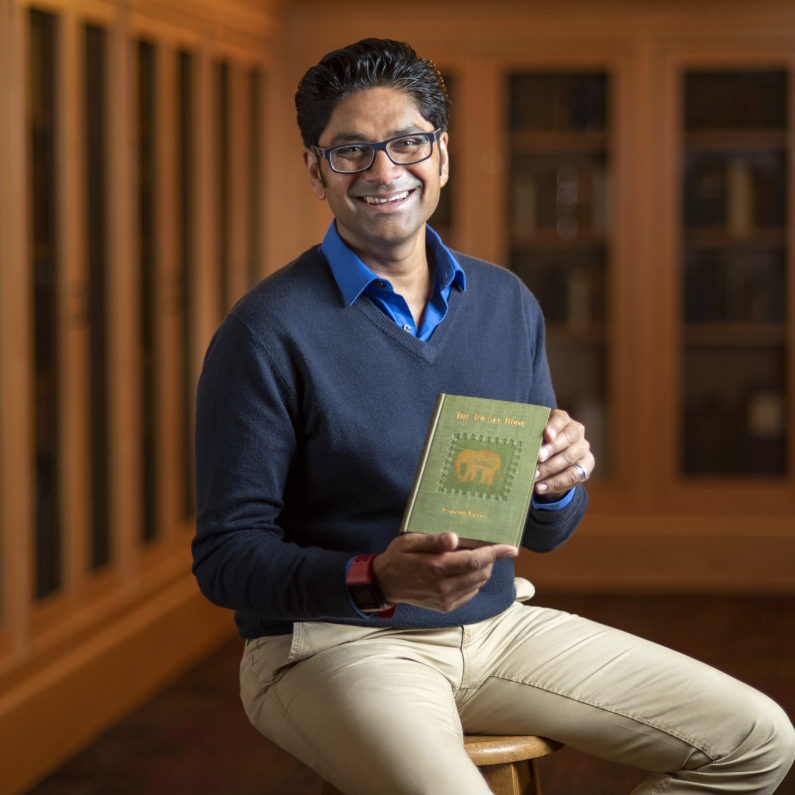 Krish Seetah with the 1894 American first edition of The Jungle Book