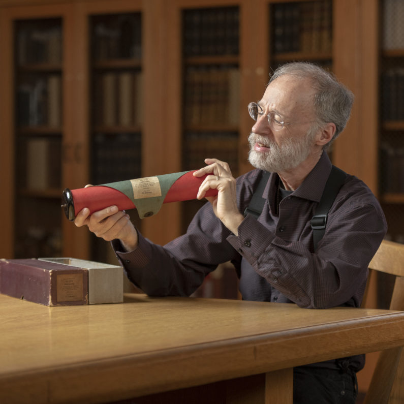 George Barth with a piano roll played by Claude Debussy.