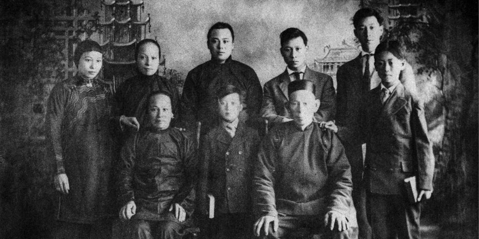 Black and white photo of Hong family posing.