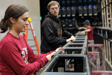 Shop carpenter Kaitlyn Khayat and stage technology specialist Daniel Cadigan