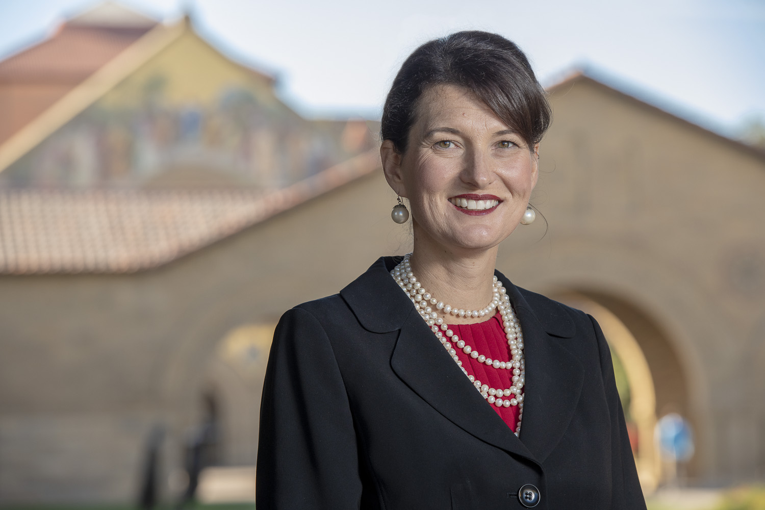 The Rev. Dr. Tiffany L. Steinwert, with Stanford Memorial Church in the background