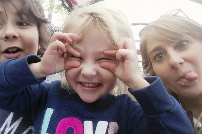 Eagleman and her kids making silly faces.