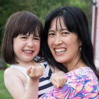 Cheuk holding her daughter.