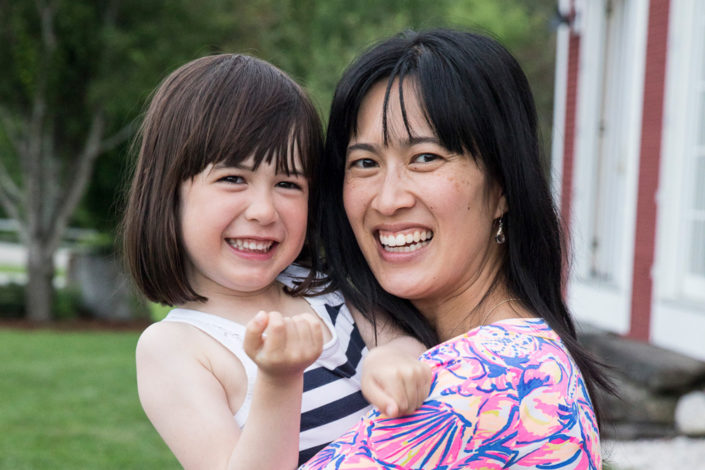 Cheuk holding her daughter.