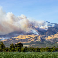 Helicopters fight wildfire in hills above Ventura County, California.