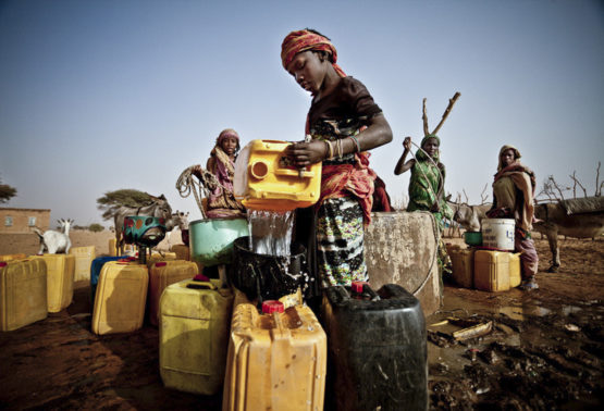 Fari Awade draws water from a well in the community of Natriguel, Mauritania.