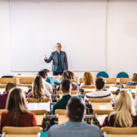 High school class in large lecture hall.