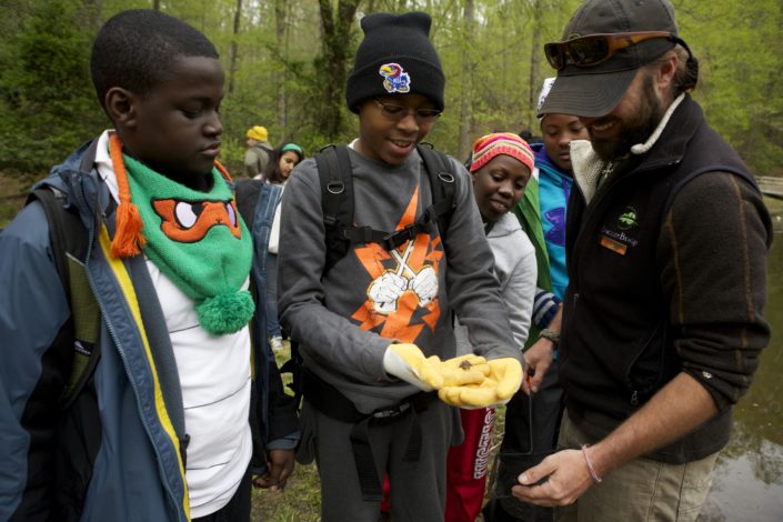 Middle-school students study the health of the watershed during an overnight visit to an environmental science camp in Prince William Forest Park in Virginia.)