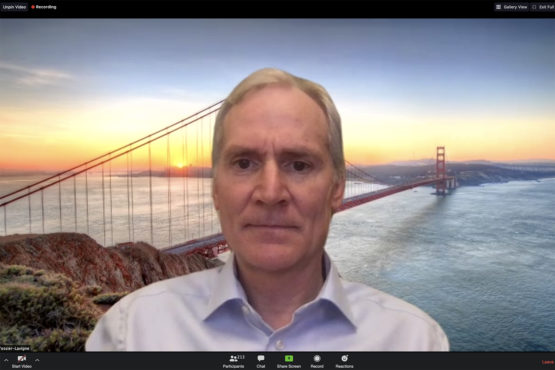 Marc Tessier-Lavigne in front of a screen showing the Golden Gate Bridge