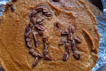 Pumpkin pie with penguin shaped decorations