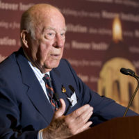 George Shultz at podium