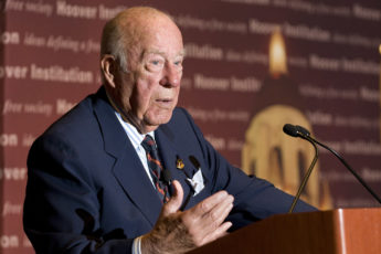 George Shultz at podium