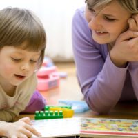 mother and child reading together