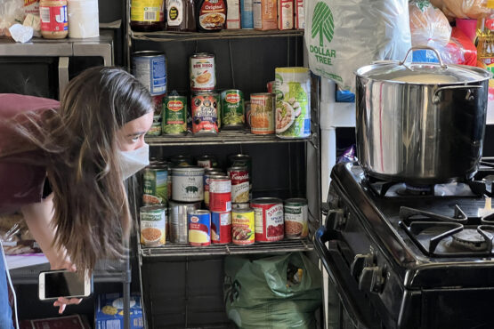 Stanford graduate student Metta Nicholson preparing to test a gas stove in Bakersfield, California.