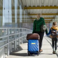 Ukrainian mother and daughter in airport