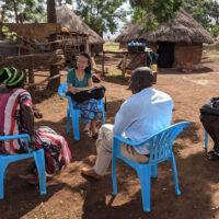 Stanford researcher Christine Pu interviews residents of rural Uganda to understand local perceptions and definitions of poverty.