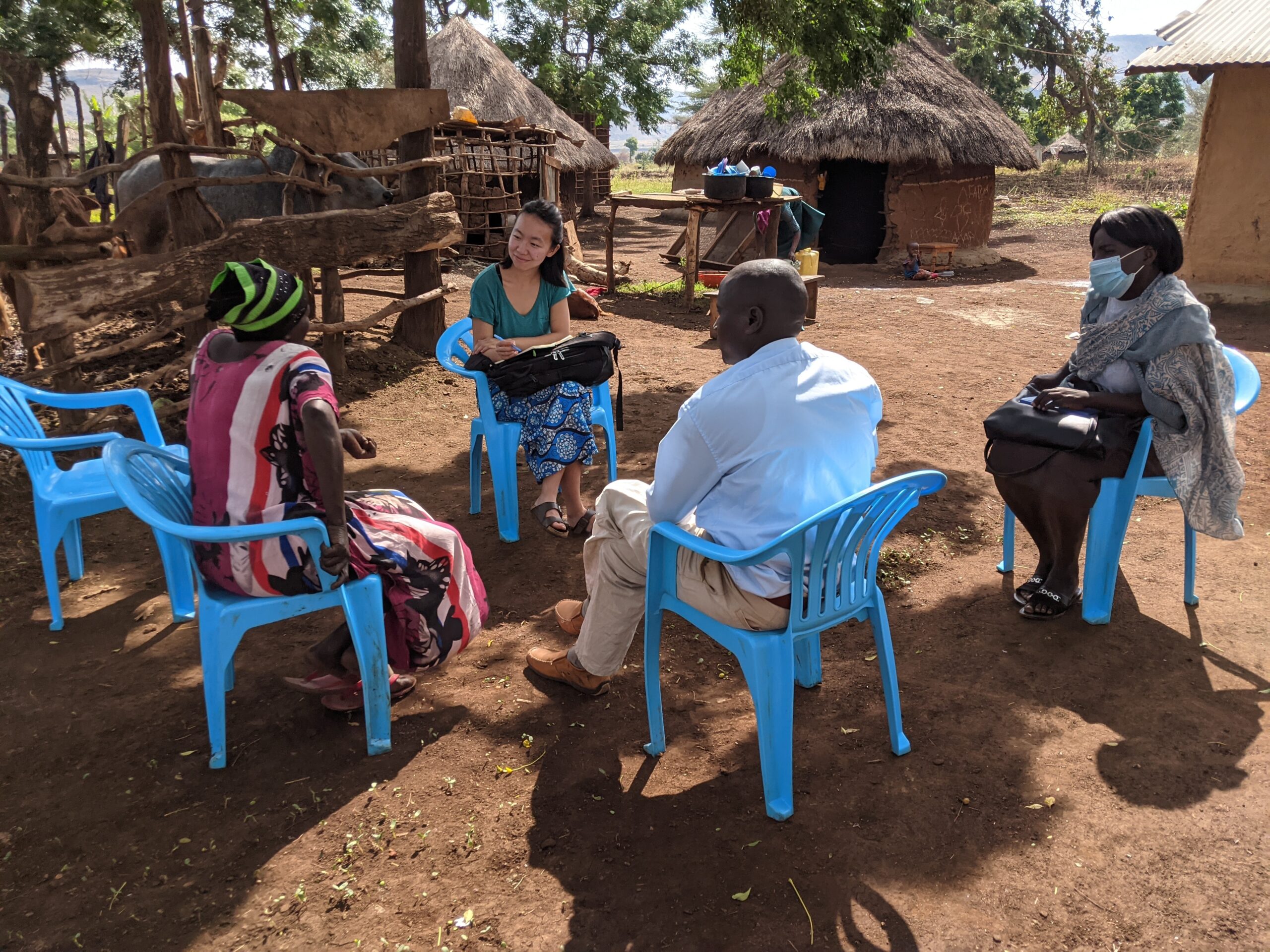 Christine Pu sitting in discussion with three other people outside