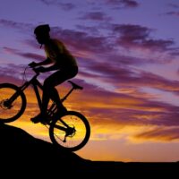 Man riding bicycle uphill